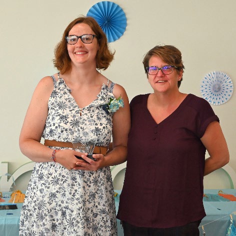 Curative Connections member Stephanie receives the Top Effort Award at Curative Connections.