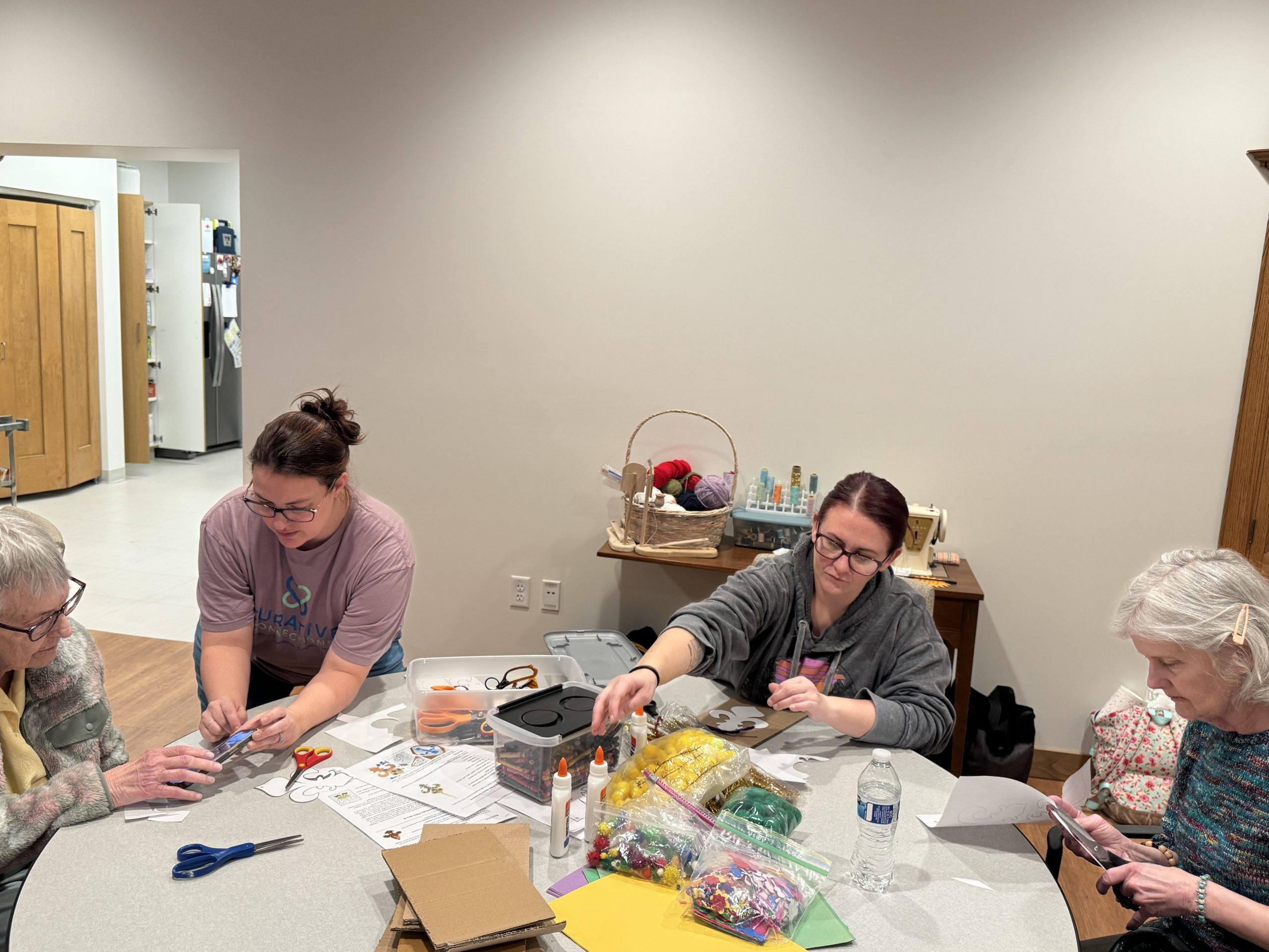 group of members and staff crafting